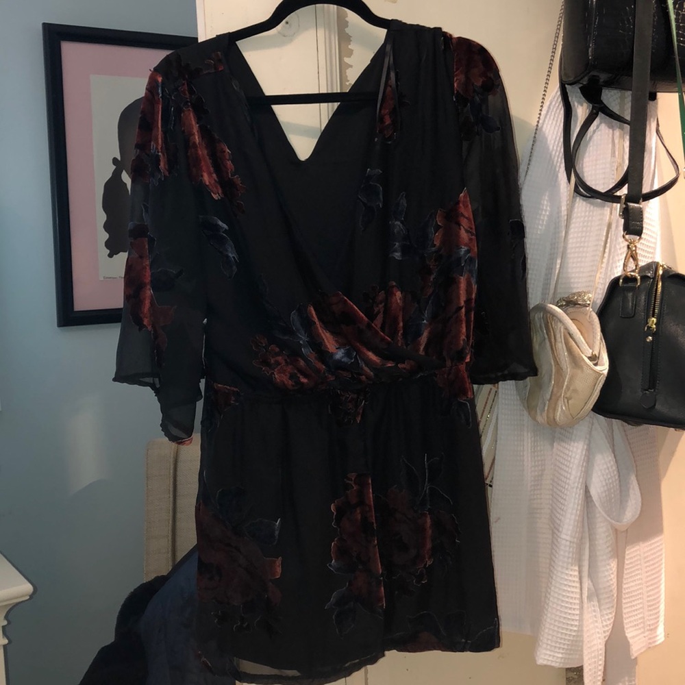 Black romper with blue and red velvet details